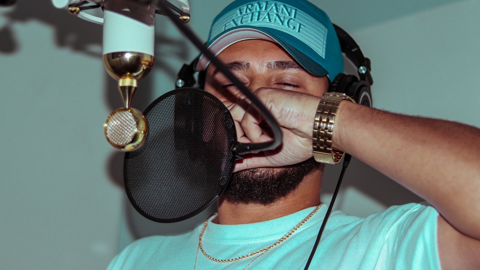 Rapper recording vocals in a studio